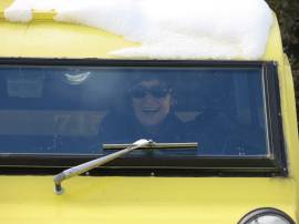 Co-opting a snowcoach used to haul people over Tower Junction Road