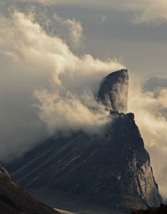 Mt. Thor, shedding storm clouds