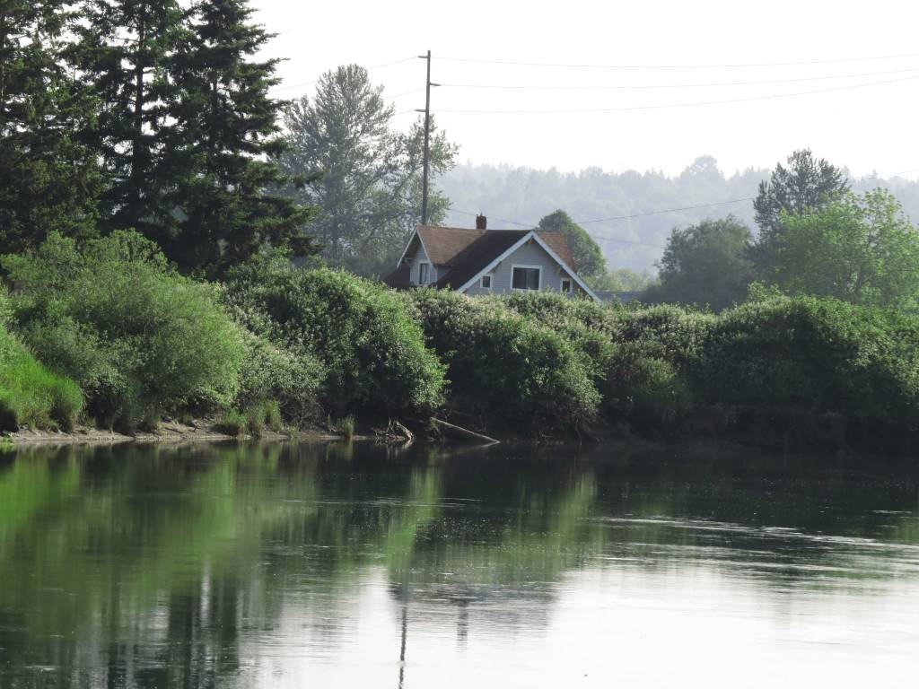 Calm river below smoky skies